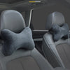 Gray memory foam car neck pillows installed in the back seat of a vehicle.