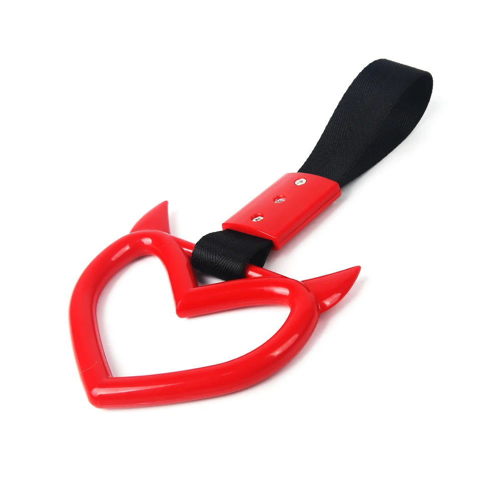 Red car rear bumper warning strap with a black handle and hand pull ring.