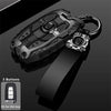 A black universal car key fob cover for Hyundai and Kia models shown with a separate key ring.