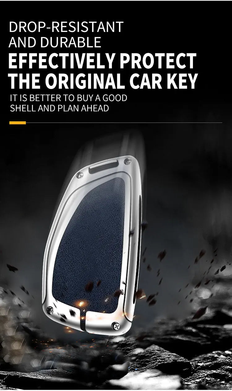 A close-up view of a drop-resistant, durable zinc alloy car key case being protected against impact.