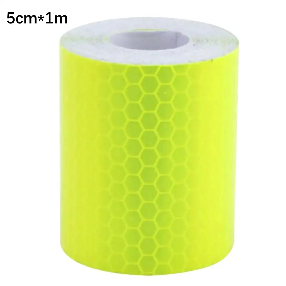 A roll of bright yellow high-visibility reflective tape, 5cm wide and 1 meter long.
