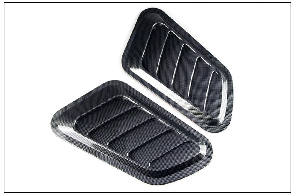 Black decorative air intake vent for a car hood