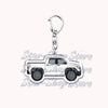 Silver acrylic keychain featuring a detailed off-road truck model.