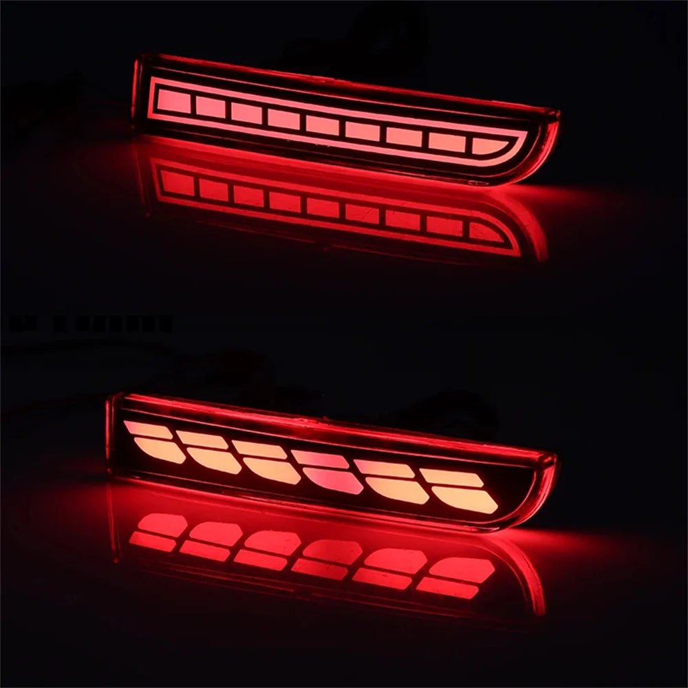 A pair of red LED rear bumper reflector lights with sequential turn signals mounted on a vehicle.