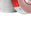 Roll of 3M high-visibility reflective decal tape in red and white, showing the spiral packaging.