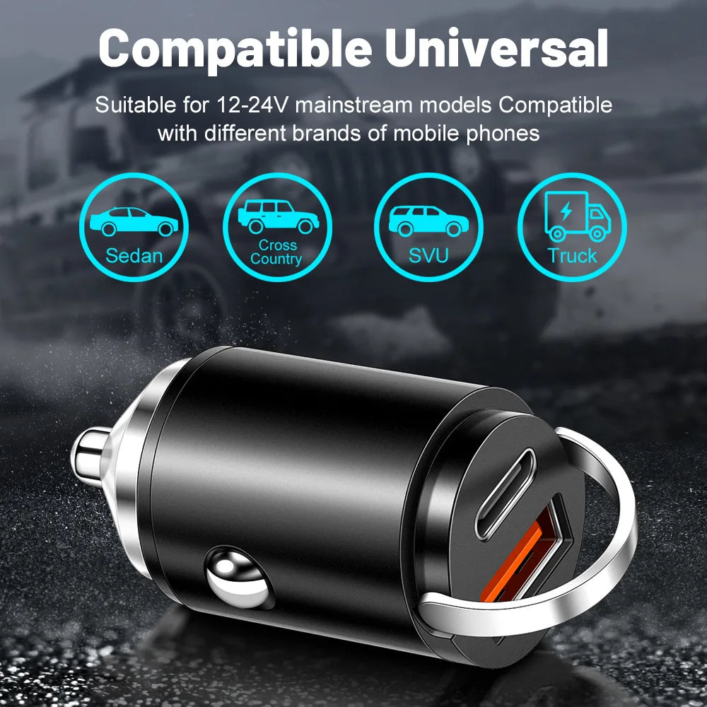 A black dual port car charger with a silver ring, shown against a dark background.