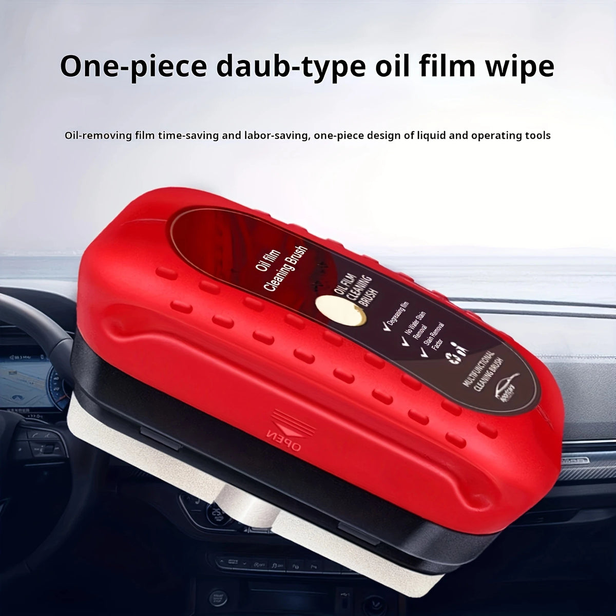 A red one-piece daub-type oil film wipe tool is shown resting on a car dashboard.