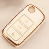 A white silicone TPU car key cover protector with gold accents and a circular opening.