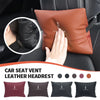 Brown leather car seat vent headrest pillow with Lincoln branding shown in detail.
