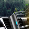 A sleek, cylindrical aroma diffuser is shown resting on a car's air vent.