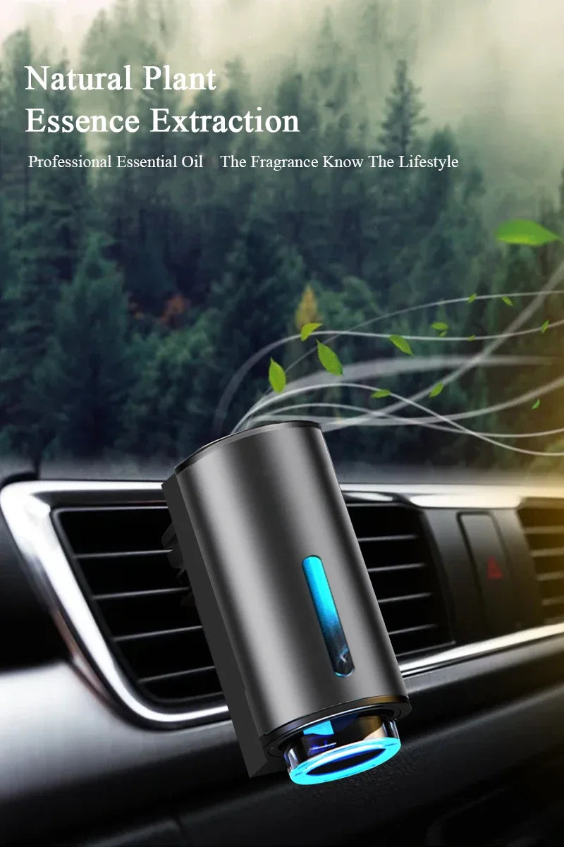 A sleek, cylindrical aroma diffuser is shown resting on a car's air vent.