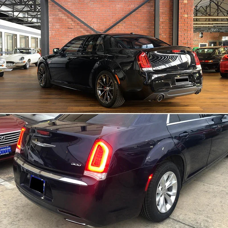 A black Chrysler 300 sedan with aftermarket rear bumper reflector light covers.