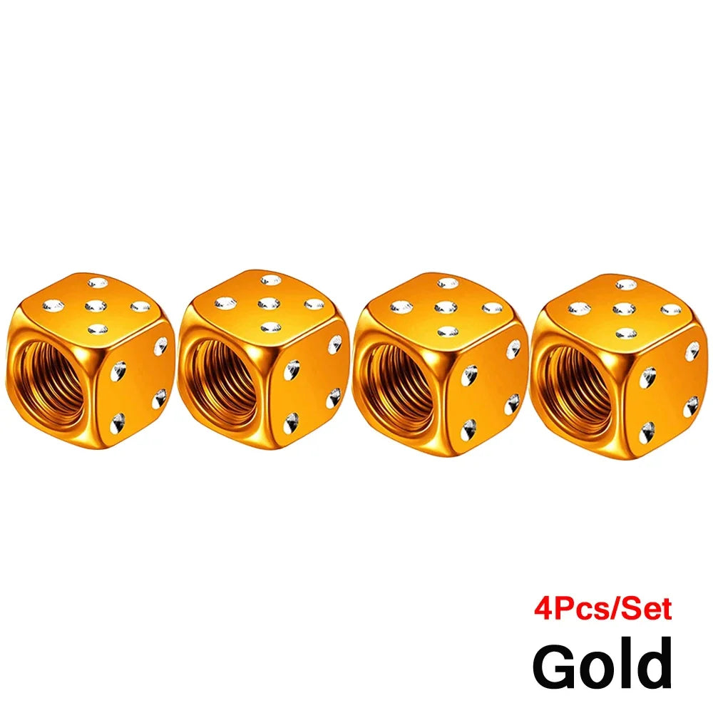 Set of four gold aluminum dice valve caps for tires