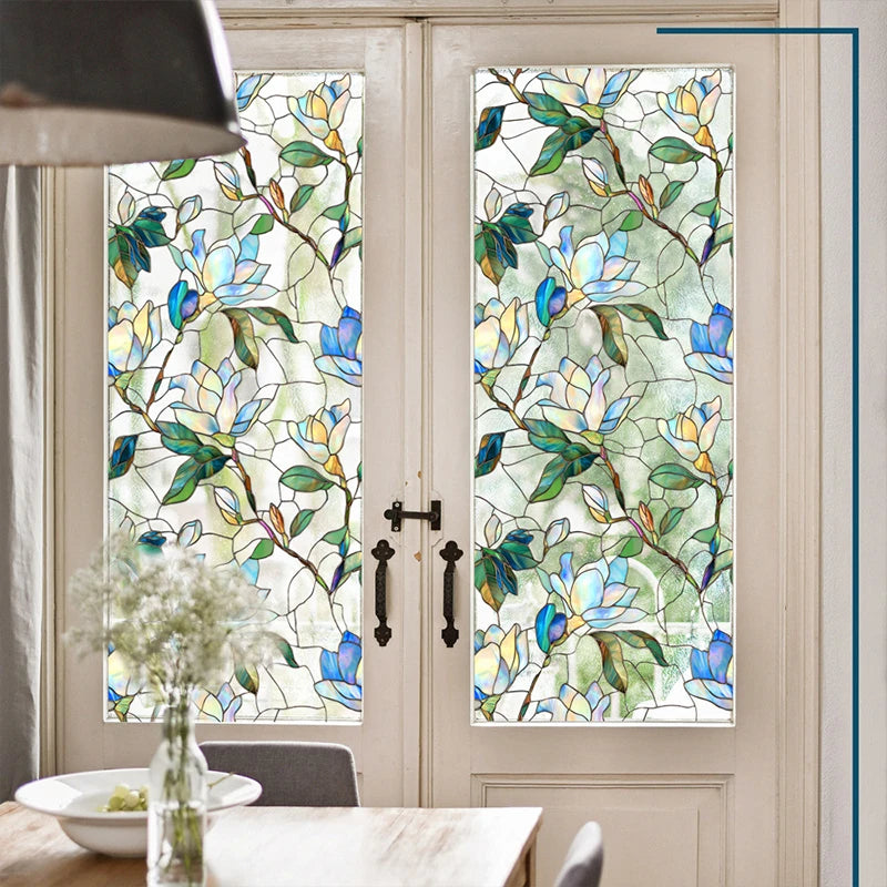Decorative PVC stained glass window film in a vertical panel set within a white door frame.