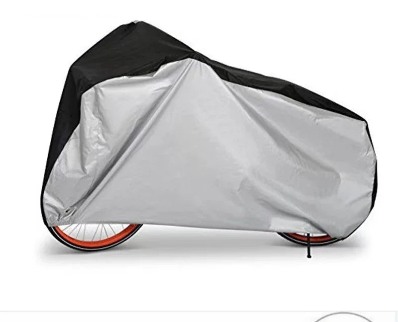 A gray and black all-weather bicycle cover is shown folded on a bicycle frame.