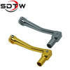 A pair of universal motorcycle gear shift levers, one silver and one gold color.