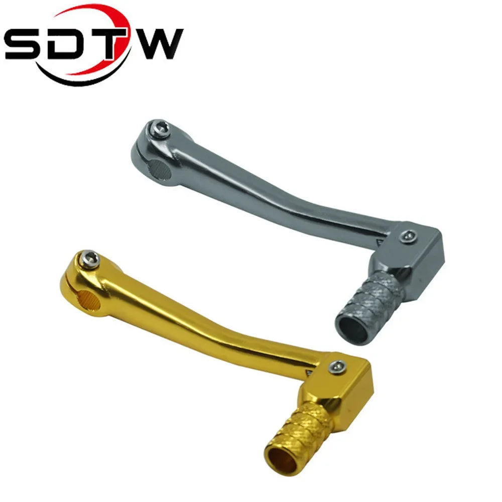 A pair of universal motorcycle gear shift levers, one silver and one gold color.