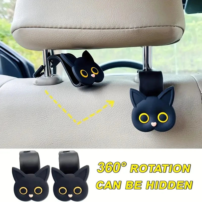 Black 3D cartoon cat headrest hooks used for universal storage, featuring a 360 degree rotation capability.