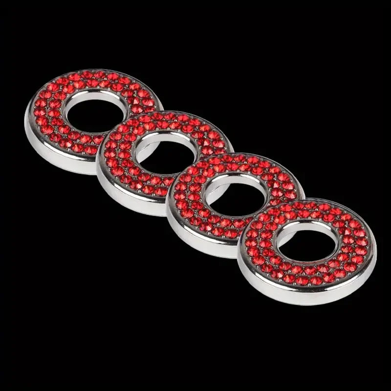 A set of elegant car door lock pin trim rings featuring red gemstones and silver metal.