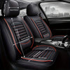 Black universal car seat covers installed in a vehicle interior, showing the seat and headrest.