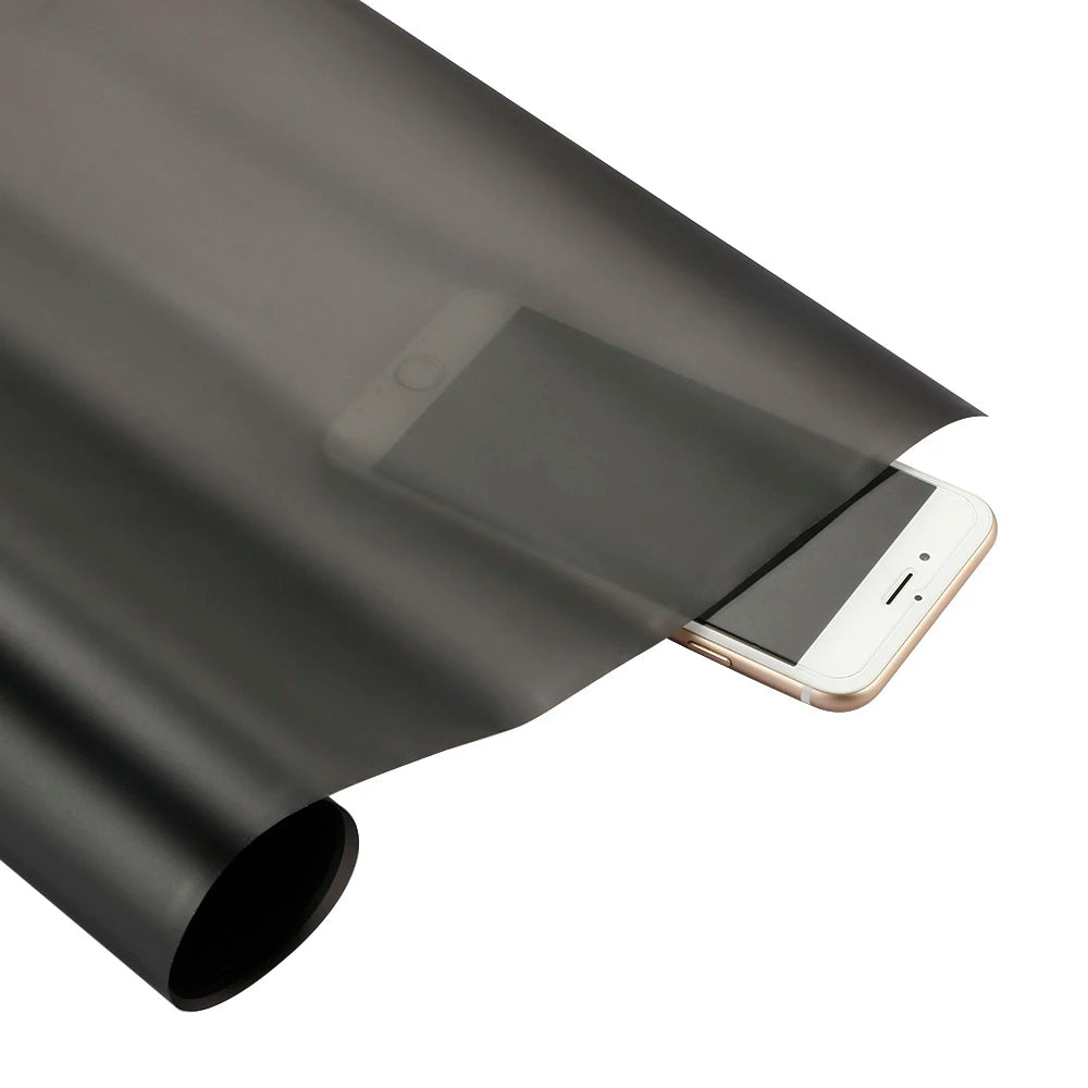 A matte smoke tint vinyl decal for car lights is shown in a close-up view.