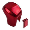 A glossy red carbon fiber gear shifting knob cover for a Honda Civic.