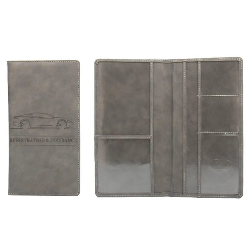 A grey leather document and ID holder with a silhouette of a car embossed on the cover.
