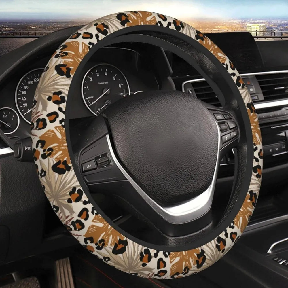 A steering wheel covered in a leopard cheetah print material inside a car