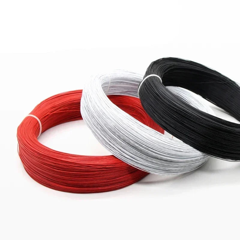 Spools of flexible LED wire in red, white, and black colors.