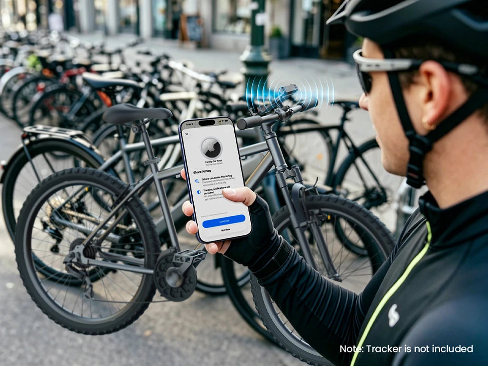 A person holds a smartphone attached to a bike, demonstrating a phone holder for motorcycle safety.