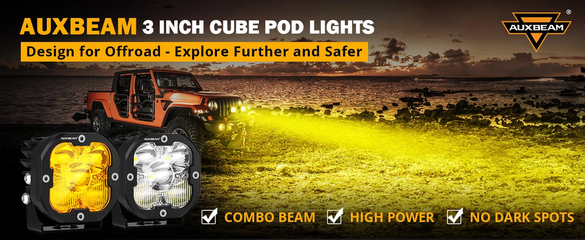 Three 3 inch cube pod lights for off-road driving, shown mounted on a vehicle in a rugged outdoor setting.