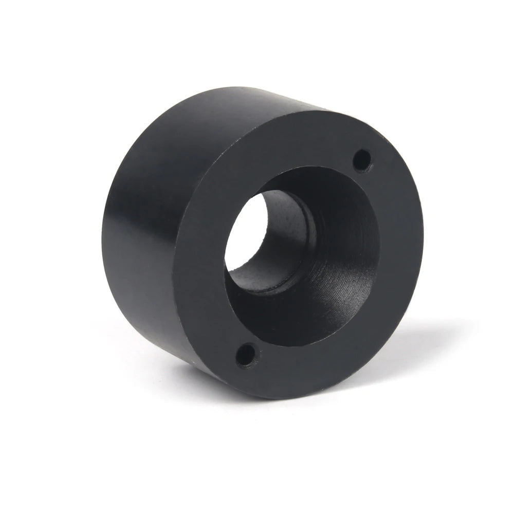 A black universal wheel stud replacement tool with a cylindrical body and mounting holes.