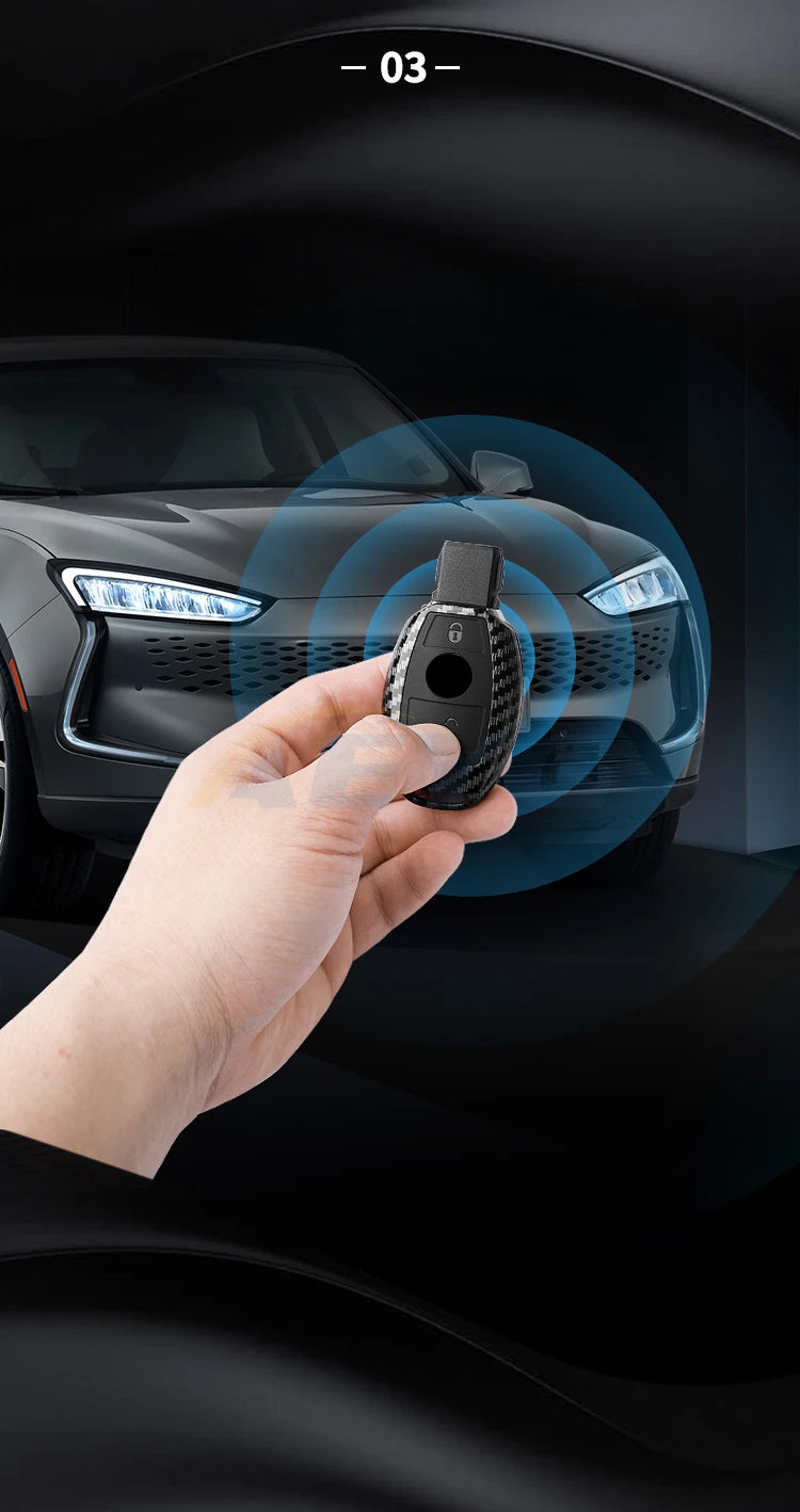A hand holds a carbon fiber car key cover, demonstrating its fit for a Mercedes vehicle.