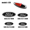A set of Ford aluminum hood and trunk emblem badges in various sizes and finishes.