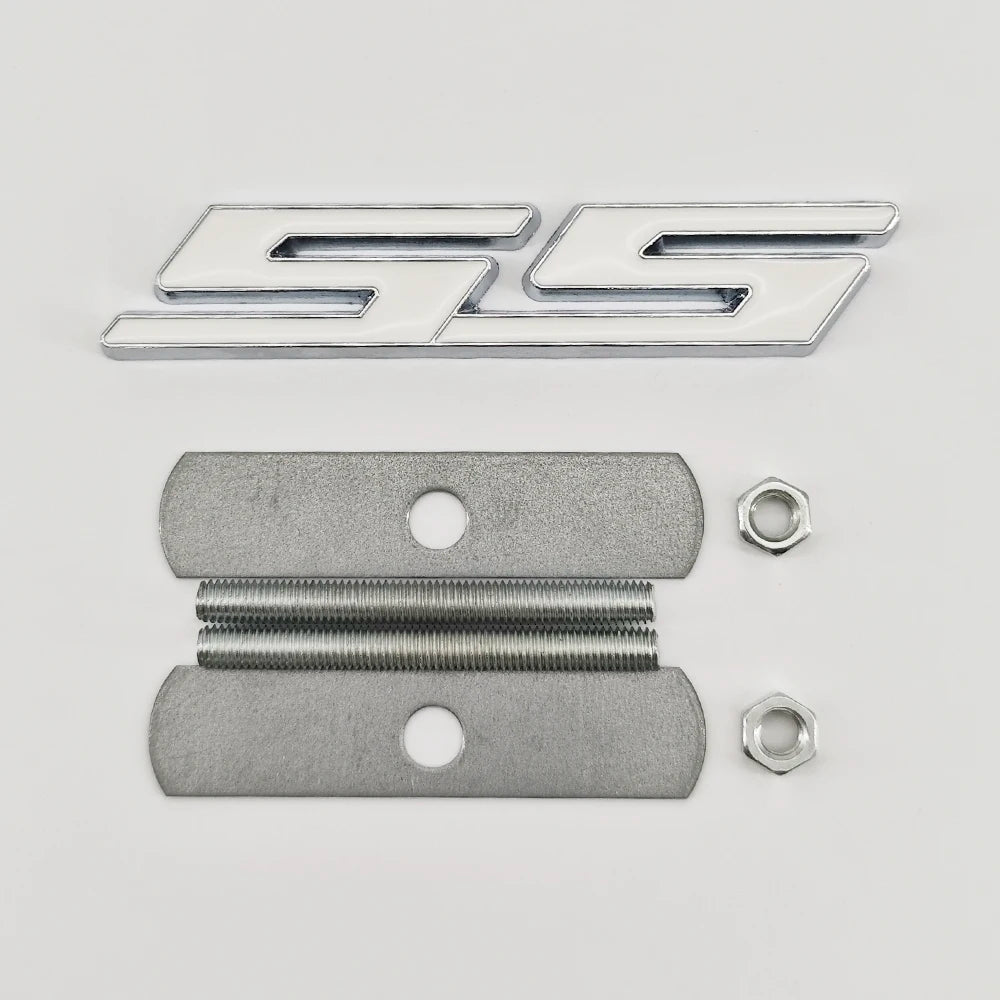 A silver metal emblem badge featuring the SS design and two threaded bolts.