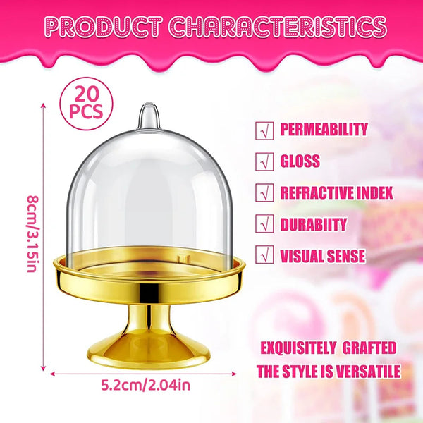 A clear glass dome display stand with a gold base for showcasing mini cupcakes or candies.