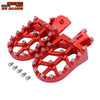 Red heavy-duty CNC foot pegs for motorcycles with mounting bolts