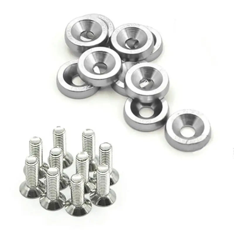 A collection of silver aluminum fender fasteners, including various sized bolts and washers.