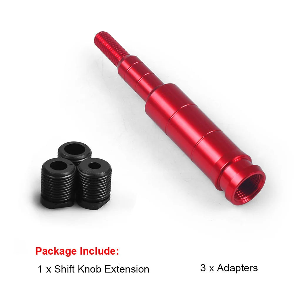 A red aluminum gear knob extension and three black adapters for a shift lever.