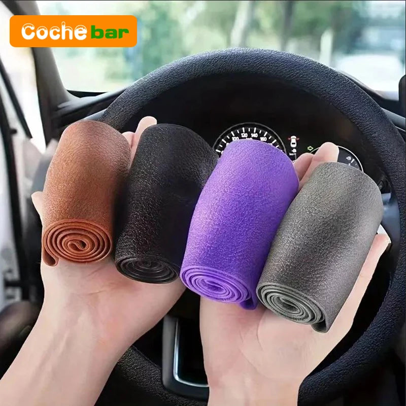 Hands holding rolled silicone steering wheel covers in various colors inside a car