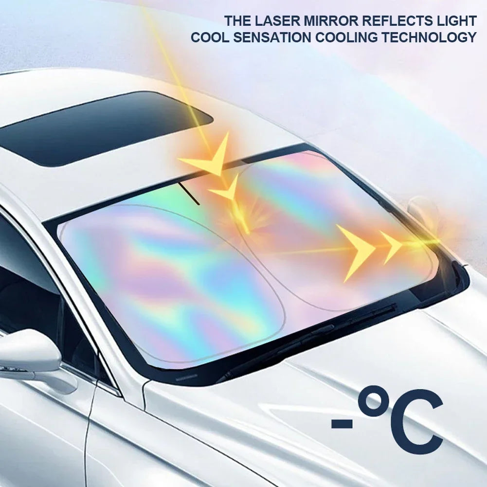 A close-up of a car windshield with a reflective sun shade installed, showing light refraction and a temperature reading.