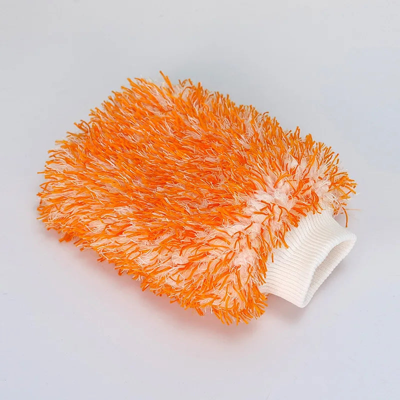 An orange microfiber cleaning glove with a white wrist strap is shown against a white background.