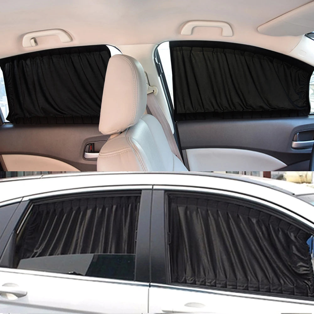 Interior view of a car showing black sun shades covering the side windows and headrests.