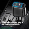 A black portable power bank with a digital display is plugged into a car charger port.