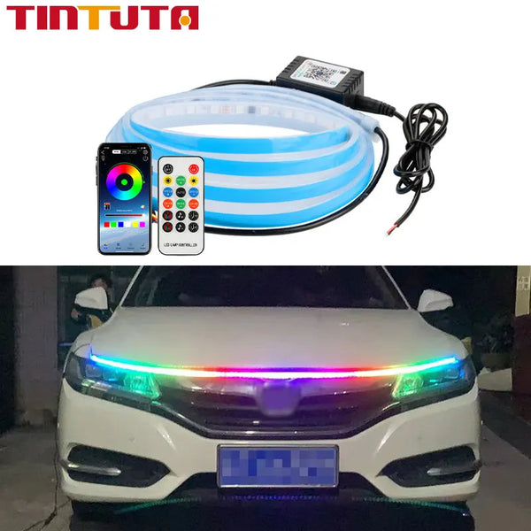 An RGB LED light strip is installed on the front hood of a white car.