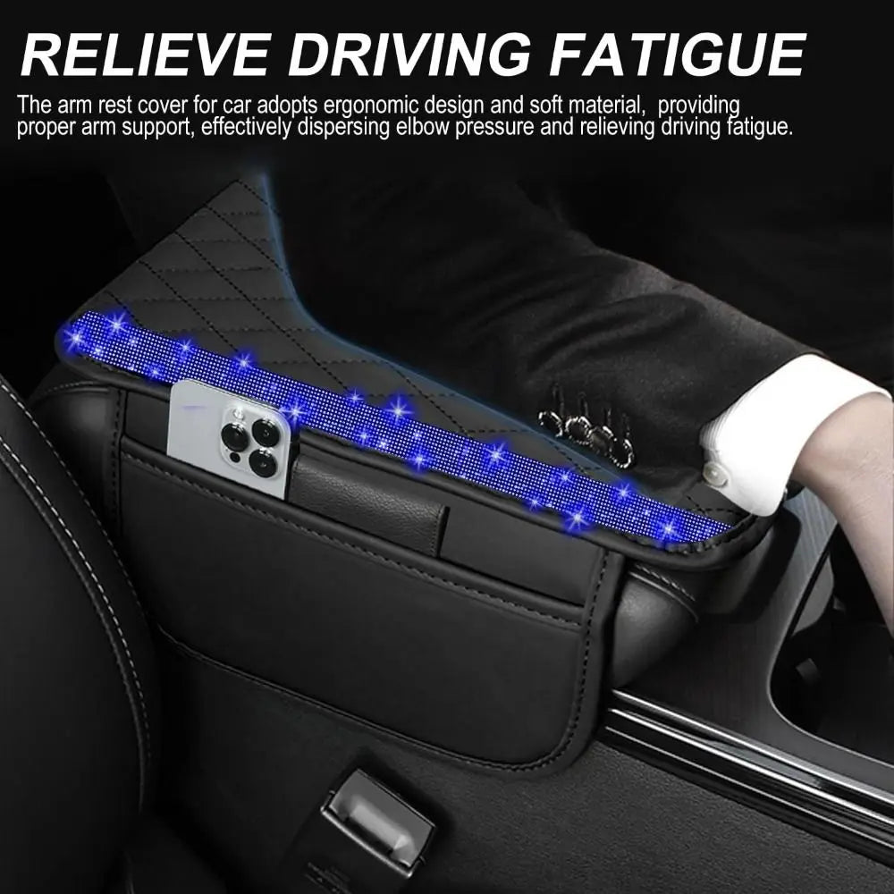 A black car console cover with a diamond grid pattern and a smartphone mounted on it.