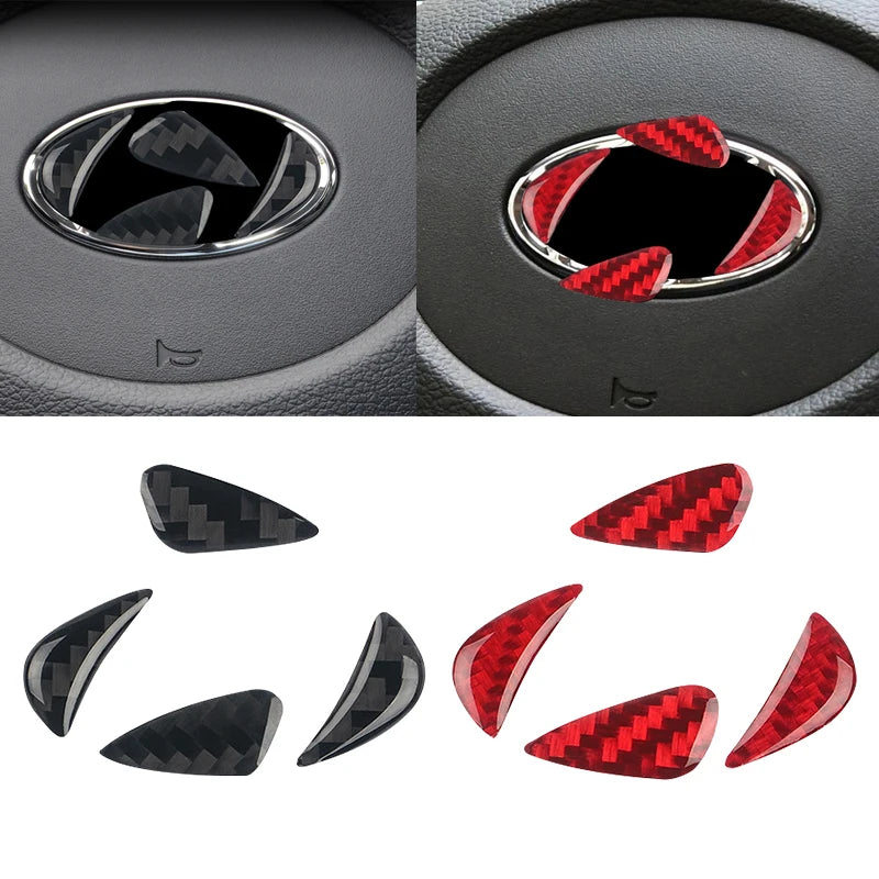 Close-up view of carbon fiber steering wheel trim decals showing black and red patterns.