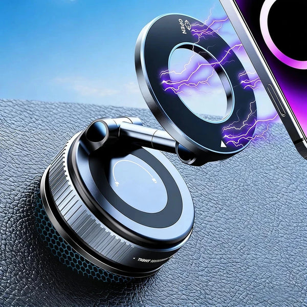 A close-up of a 360° rotating magnetic phone holder device resting on a dark surface next to a smartphone.