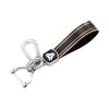 A black and gold multi-function car key cover for GMC, Chevrolet, and Buick models.