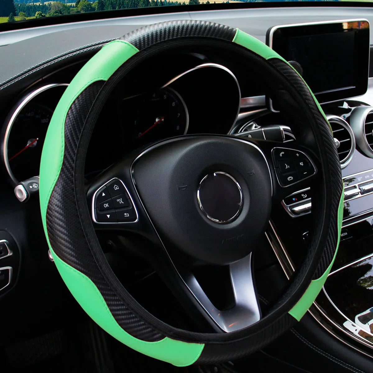 A black steering wheel with a bright lime green PU carbon fiber cover installed in a car interior.